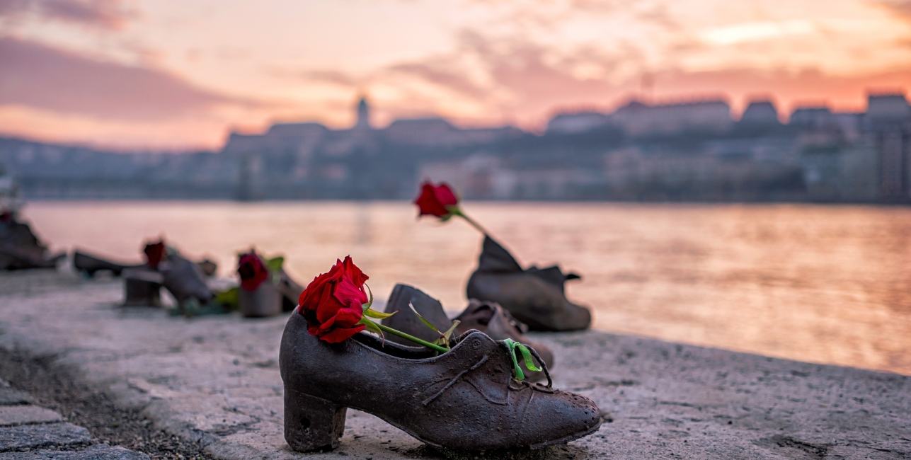 "Shoes on the Danube bank" - Monument as a memorial of the victims of the Holocaust during WWII on the bank of the Danube at sunset in Budapest, Hungary