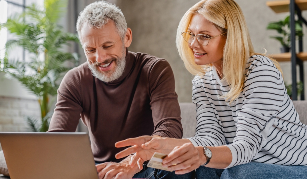 couple making a deposit with credit card